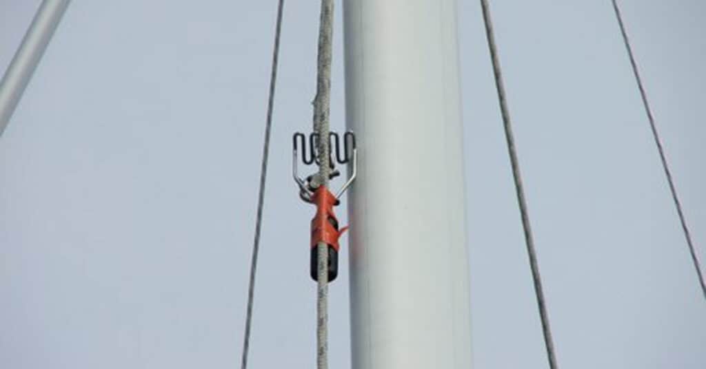 Using a potato masher to snag a loose halyard.