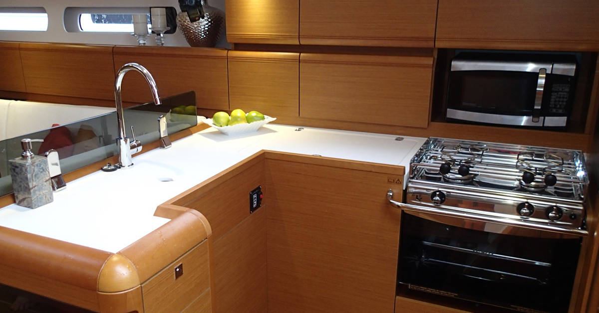 14 photos from a Caliber 40 to give you ideas for monohull galley storage. Step-by-step organizational tips to stow everything securely for easy use.