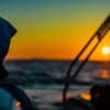 Sailboat at sunset - managing sleep on an overnight passage