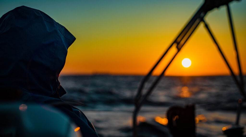 Sailboat at sunset - managing sleep on an overnight passage
