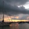 Boats at anchor a sunset - how to quiet noisy halyards