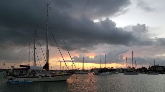 Boats at anchor a sunset - how to quiet noisy halyards