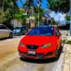 Red car parked at the curb - getting around on land when you live on a boat