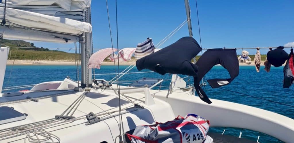  Hanging clothes on a boat clothesline without clothespins.