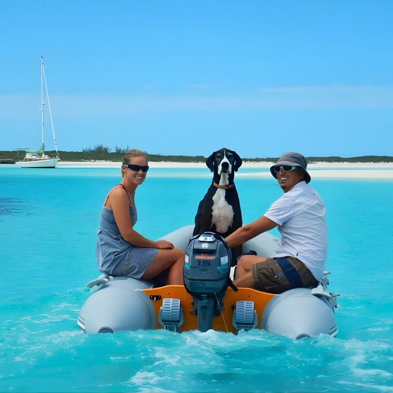 Couple in a dinghhy with a great Dane