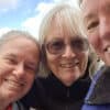 Three women smiling