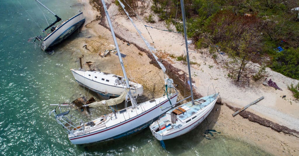 Damaged sailboats washed up on shore - find a safe spot to put your boat in a hurricane