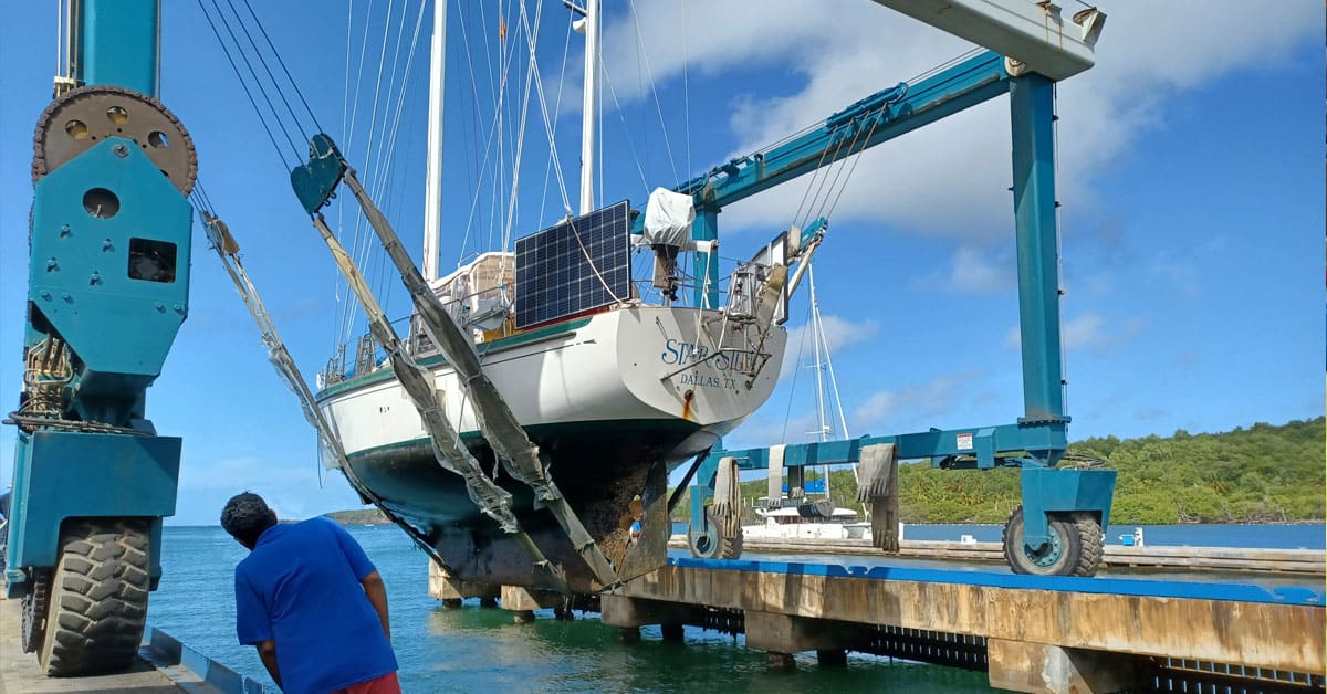 Boat in slings being hauled out - questions to ask before hauling out
