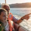 Man and girl in boat wearing life jackets - brief guests for safety