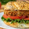 Sandwich on a bun with tomato and lettuce - lentil sloppy joes
