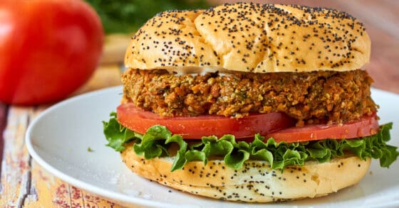 Sandwich on a bun with tomato and lettuce - lentil sloppy joes