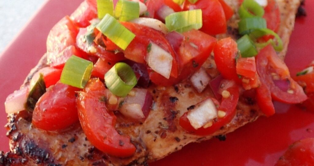 Chicken Bruschetta on a red plate: yum!