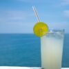 Drink with a citrus slice on the water - dangers of dehydration for cruisers