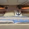 Cozy boat berth with nautical bedding — tips for sleeping well on a boat
