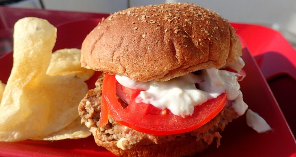 Gyro burger recipe -- easy at-home treat, with low carb and dairy-free options. Great grill-out meal for guests, all the prep can be done ahead.