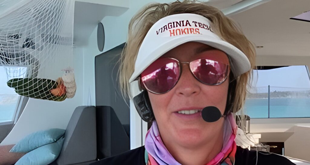 Woman wearing boat communication headset with visor and sunglasses showing compatibility with hats and glasses