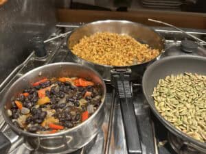Black bean and sweet potato taco ingredients with roasted pumpkin seeds