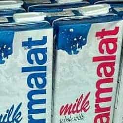 Resealable flip-top on a Parmalat boxed milk carton — tape it down or transfer to a screw-top bottle to prevent spills aboard