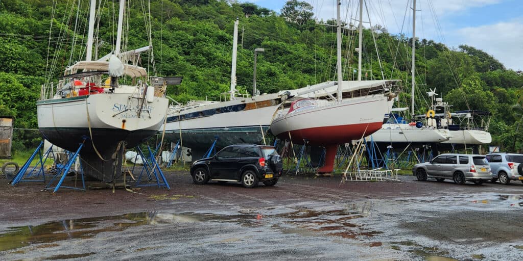 A sailboat hauled out and blocked on the hard, prepped for an approaching hurricane