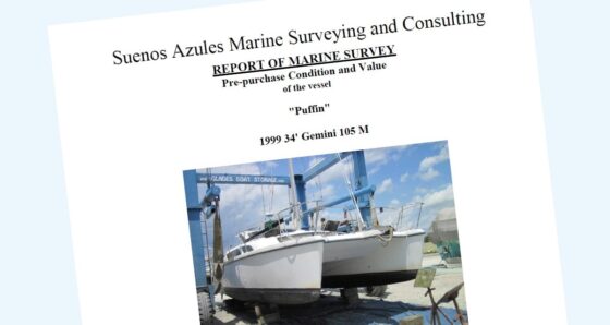 Pre-purchase boat survey report cover with a sailboat hauled in the slings at a boatyard for inspection.