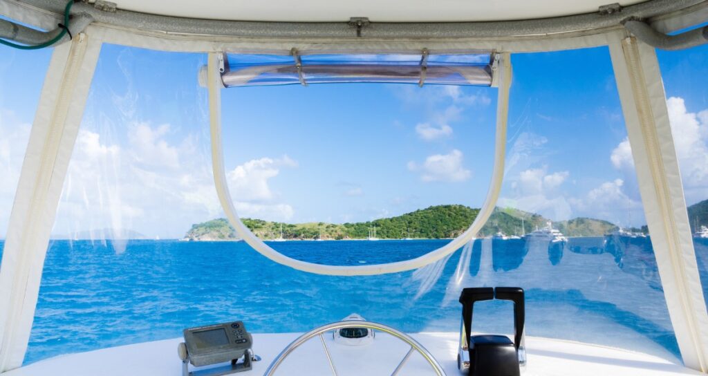View through a boat windshield that can be partially unzipped.