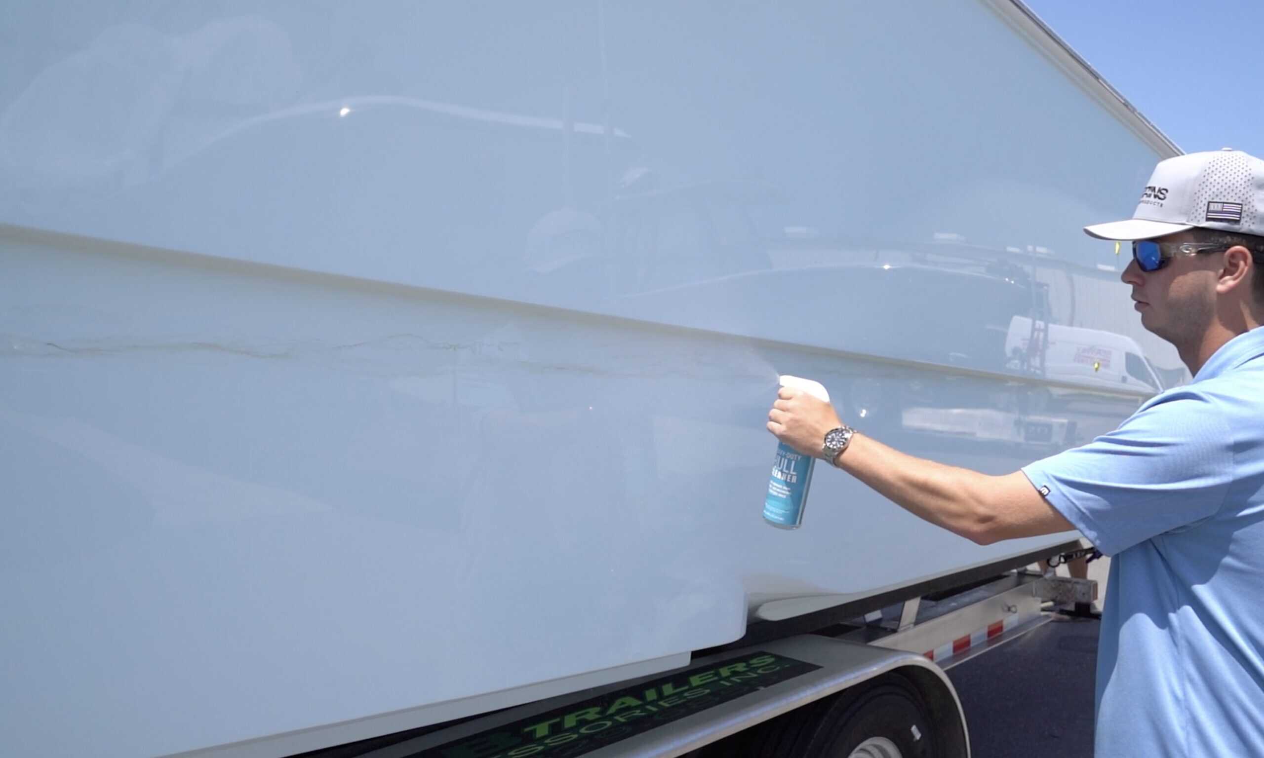 Man spraying boat hull