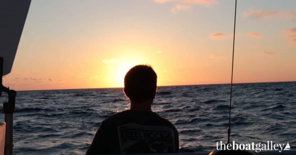 Ryan aboard Kittiwake, looking out over the water